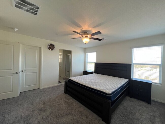 Building Photo - FULLY FURNISHED!!! beautiful 3 bedroom 2 and half bath home is located in the Symmetry Bay Cadenc...