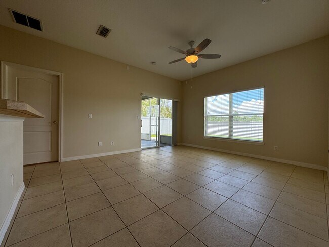 Building Photo - Beautiful 3/2 home near Lake Nona ~ Fenced In Yard ~ LVP & Tile Flooring ~ Community Pool!