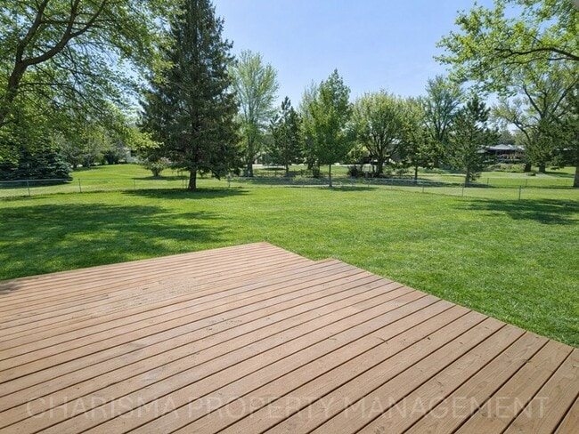 Building Photo - 4 BD, 2 BA - FENCED IN YARD, PRIVATE TRAILS, FINISHED UPPER AND LOWER LIVING AREAS, ATTACHED GARAGE!