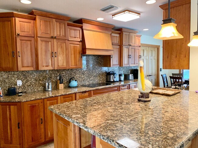 Building Photo - AVAILABLE 2027 SEASON! ! PGI HEATED POOL, WATERFRONT, BOAT LIFT