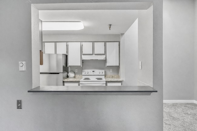 Building Photo - 2BR Condo w/ Vaulted Ceilings, W/D, Parking & Amenities | Utilities Included