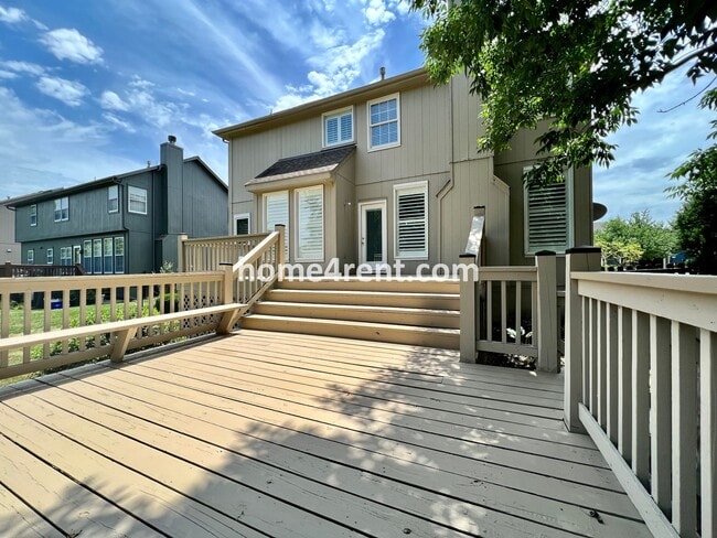 Building Photo - Updated Kitchen, Large Two Tiered Deck, Finished Basement in Blue Valley Schools!