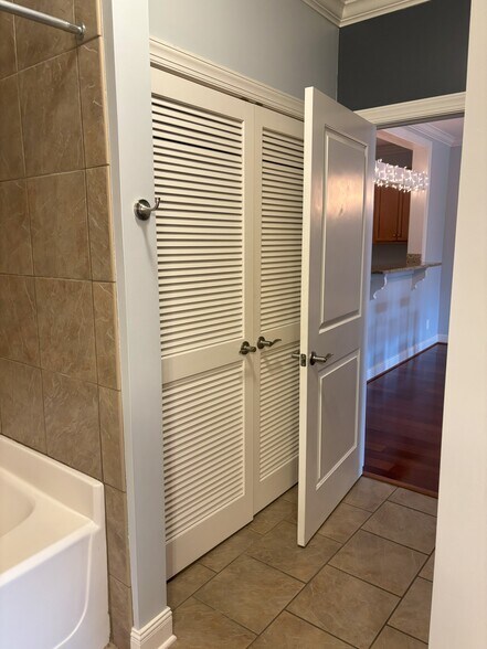 door from bathroom to primary living space/dining room - 301 Criddle St