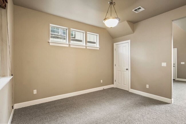 Building Photo - Spacious 4-Bedroom Home with New Paint & Carpet, Fenced Yard