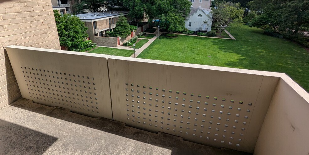 Spacious and private third-floor corner balcony overlooking the Tiber Island Great Lawn. - 490 M St SW