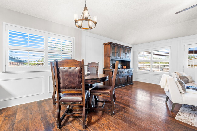 Dining room off of the kitchen with lots of natural light. SHUTTERS FOR EVERY WINDOW ARE INCLUDE - 209 Prairie Wind Blvd