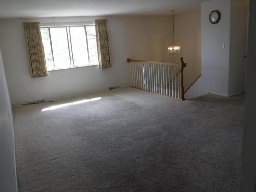 Living Room and Dining Room. Stairs to entry way. - 1273 Moore st