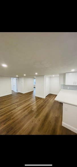 Living Room view from door. Partial kitchen island shown. - 31 Stowers St