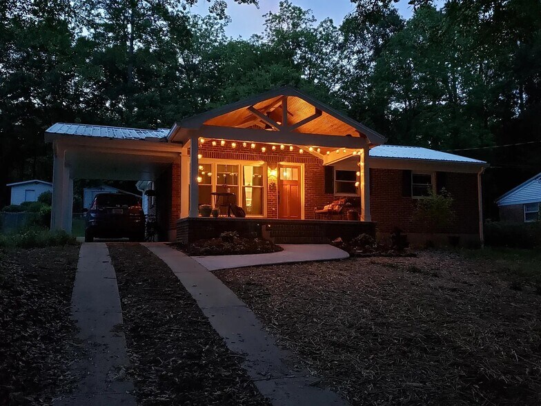 Portch at night . . . light included! - 230 Pine Needle Rd