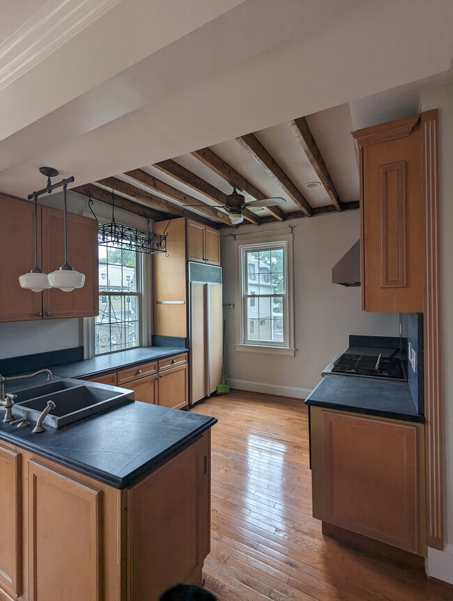 kitchen filled with light, featuring soapstone countertops - 4413 GEORGIA AVE NW