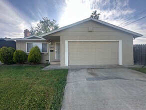 Building Photo - Recently Updated 4 Bedroom Home with Yard