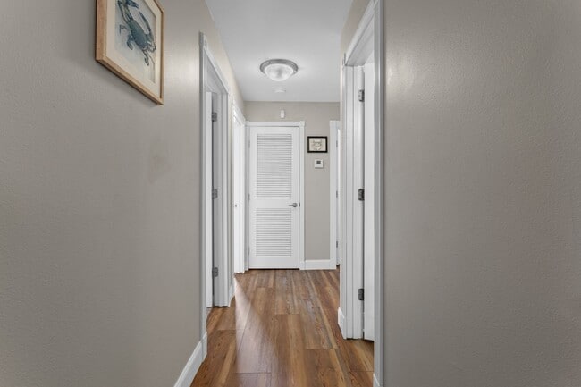 Building Photo - Welcome to Coastal Living at Harbor Landing Condominiums!