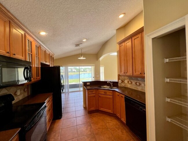 Building Photo - EAGLE CREEK LAKE NONA! WELCOME HOME! Beautiful water views! Spacious 2 story-3 bedroom 2.5 bath h...