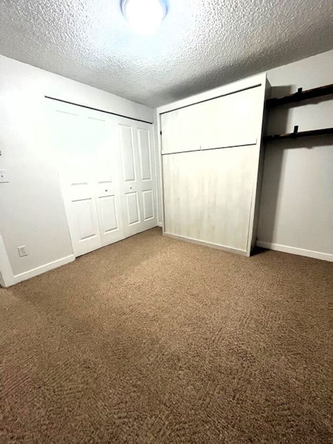 Building Photo - Long Term Rental- Creekside Condominiums #20C - UNFURNISHED