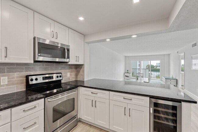 Building Photo - NEWLY RENOVATED TWO BEDROOM CONDO IN WATERFRONT RESORT STYLE COMMUNITY