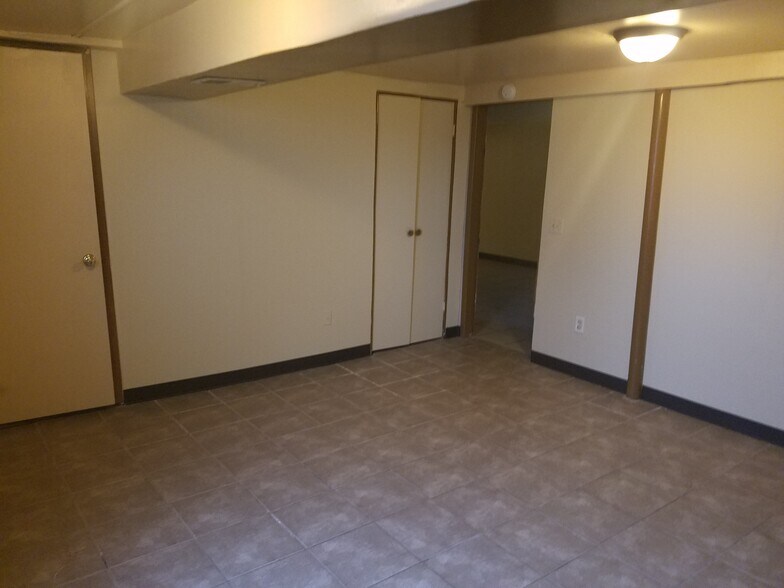 Large fourth bedroom in the partially finished basement - 1820 Bluebird Dr