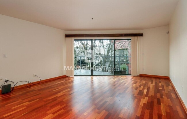 Building Photo - Spacious Riverfront Condo- Beautiful Condo w/River View from Bedroom! Parking Included!