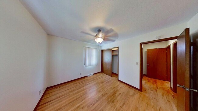 Building Photo - Updated two bedroom duplex, new stainless steel appliances, garage, and hardwood floors