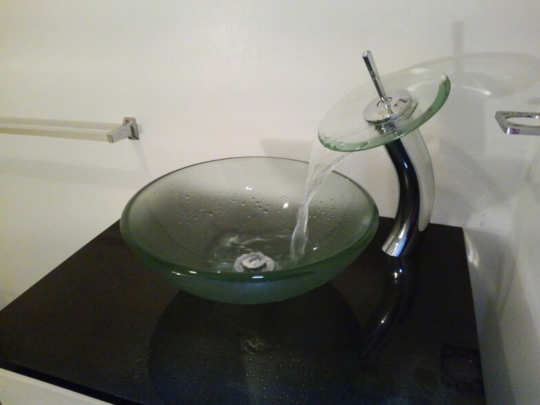 Glass vessel sin w/waterfall faucet - 534 Yates St