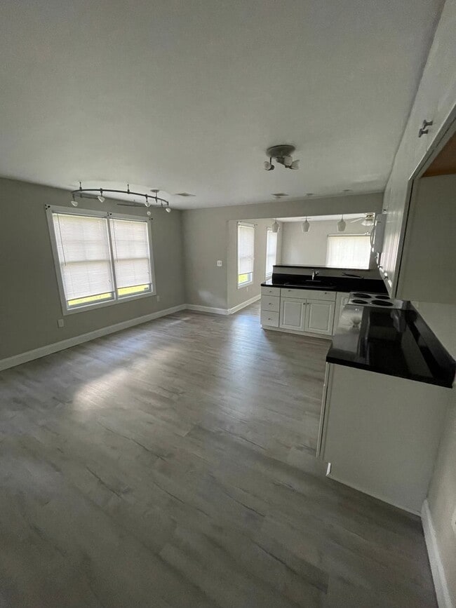 Building Photo - Ideal for Families or Roommates: 4BR/3BA Lakefront Home with Dual Private Suites