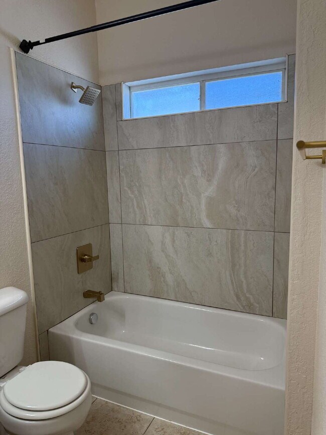 Building Photo - "Spacious 4-Bedroom Oasis with Granite Kit...