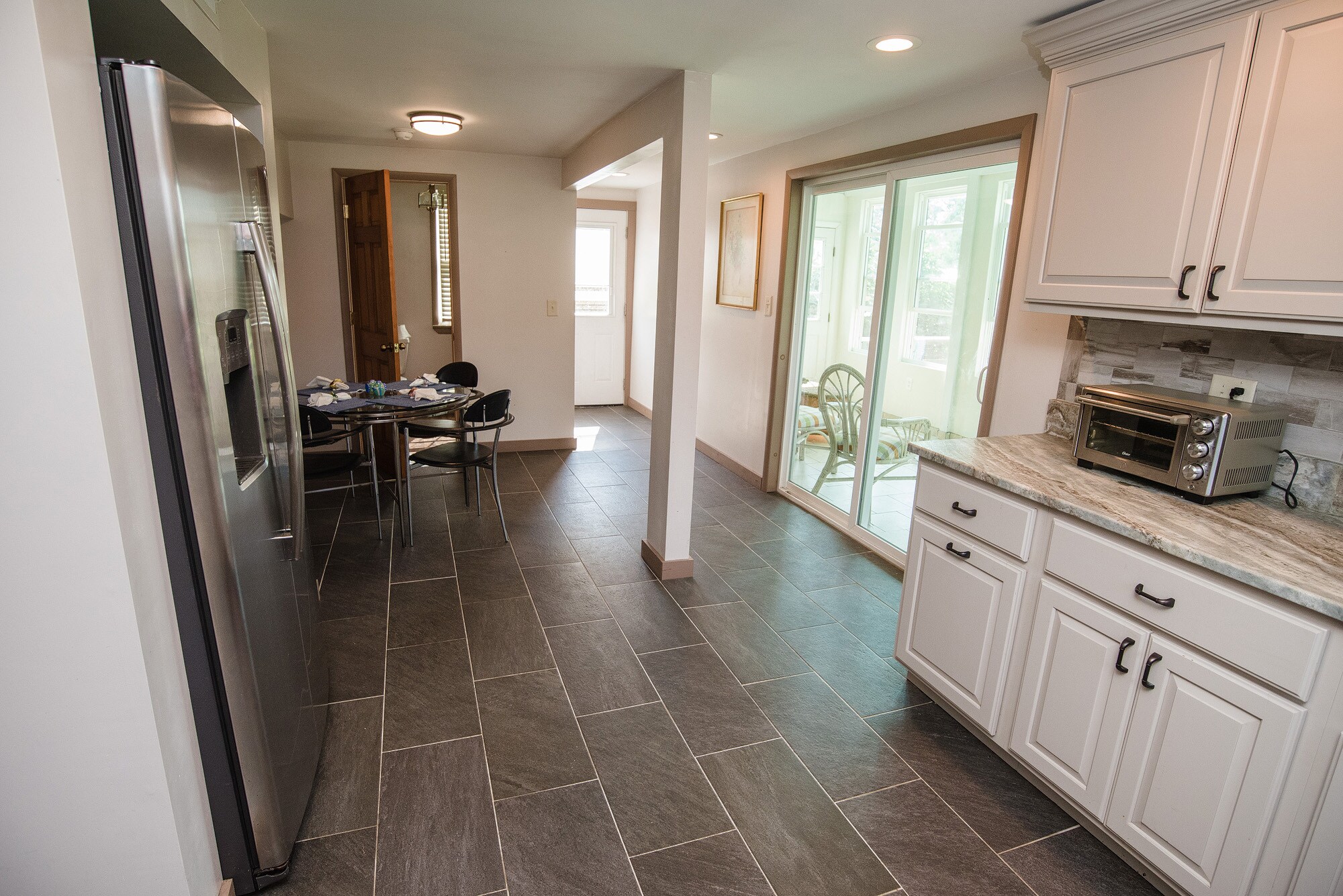 That’s the sun room through those doors. - 5277 Main St