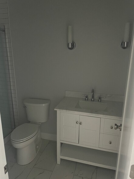 Bathroom with spacious vanity and storage - 216 Findlay St
