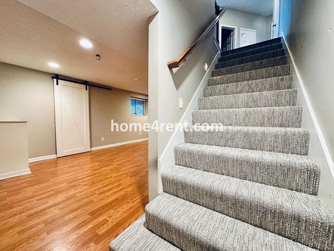 Building Photo - Updated Kitchen, Large Two Tiered Deck, Finished Basement in Blue Valley Schools!