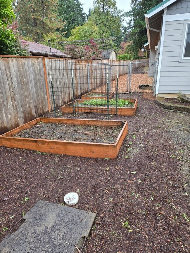 Building Photo - Large lot with tons of storage !  3 br , 2 bth + office+ 2  Car-garage + 2 Wooden Sheds