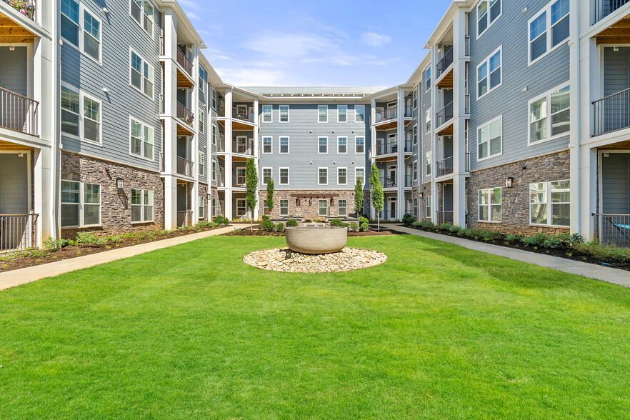 Enjoy beautiful courtyard views from your 1, 2 or 3 bedroom apartment at Hawthorne at Mills Gap - Hawthorne at Mills Gap