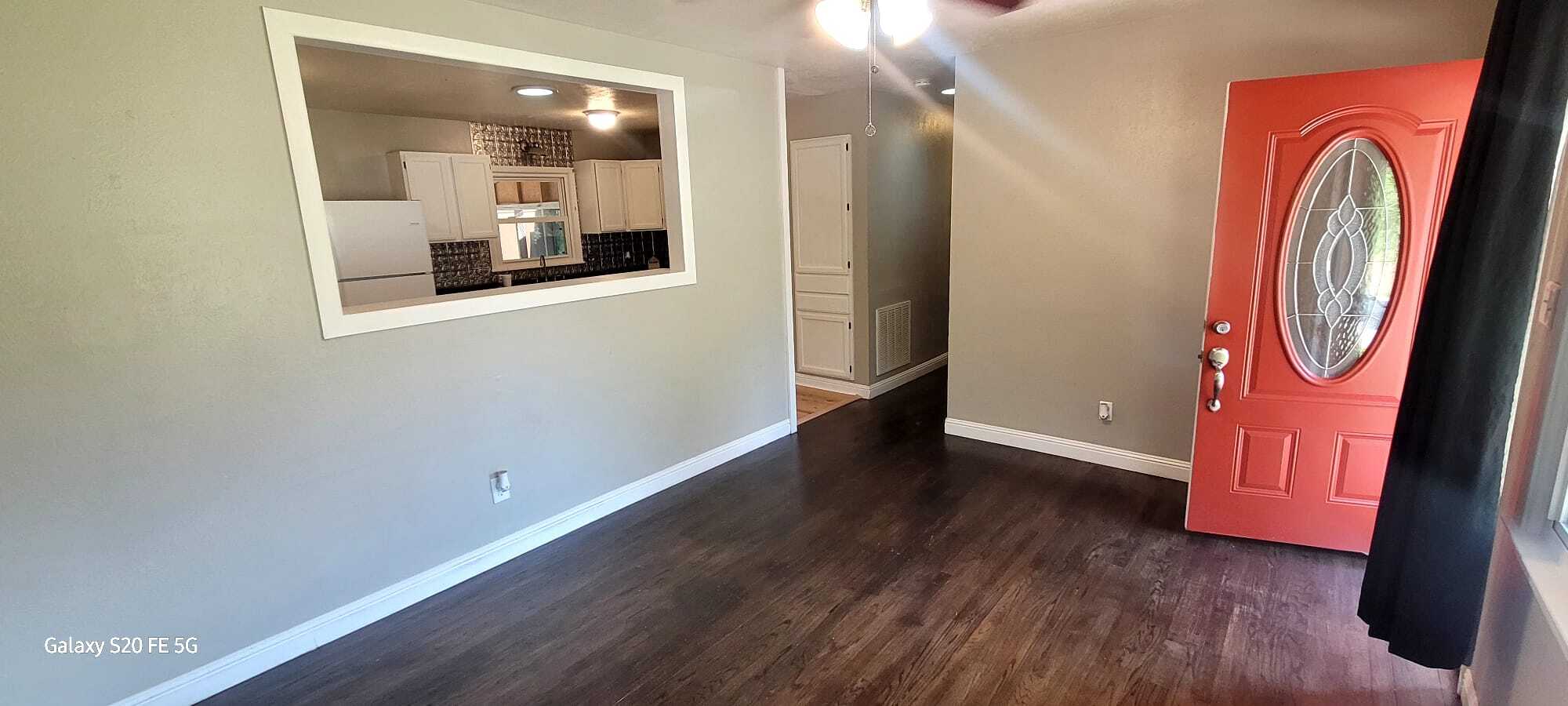 Living room with a view into the kitchen - 6037 Elstree Pl