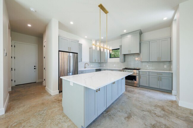Building Photo - Luxury Redefined: Experience Vibrant Living in this 3-Bedroom Haven in East Austin