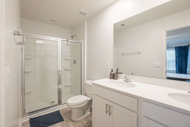 Building Photo - Partially furnished and now available!
