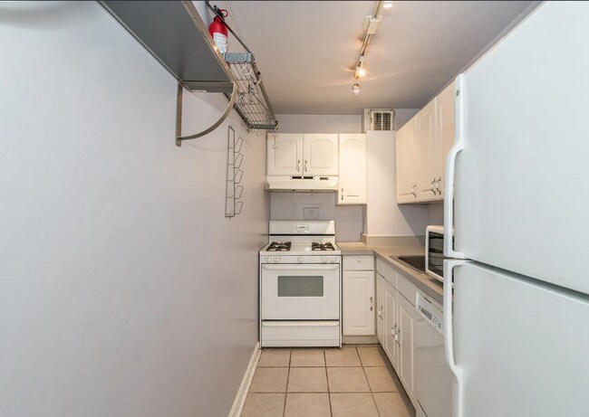 Building Photo - Bright fifth-floor one-bedroom in the heart of Dupont Circle with floor-to-ceiling windows and an...