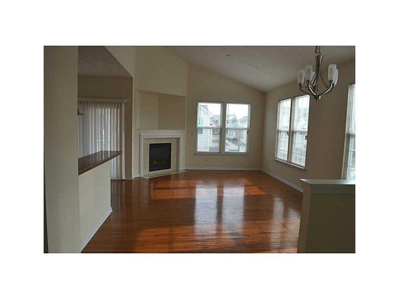 Top Floor, Living Room/Family room. Lots of natural light, wood floors, open floor plan. - 12668 Hollice Ln