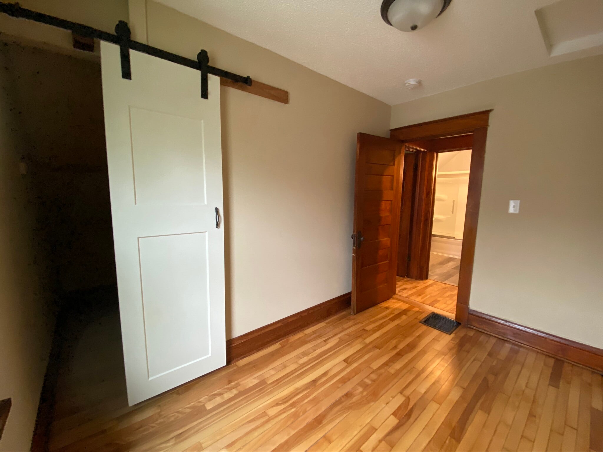 Second bedroom, with barn door and closet - 783 Edmund Ave W