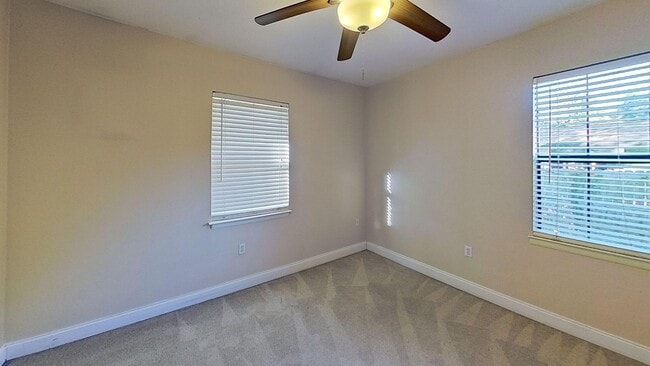 Building Photo - 3/2 with Den and extra long single car garage, huge fenced back yard