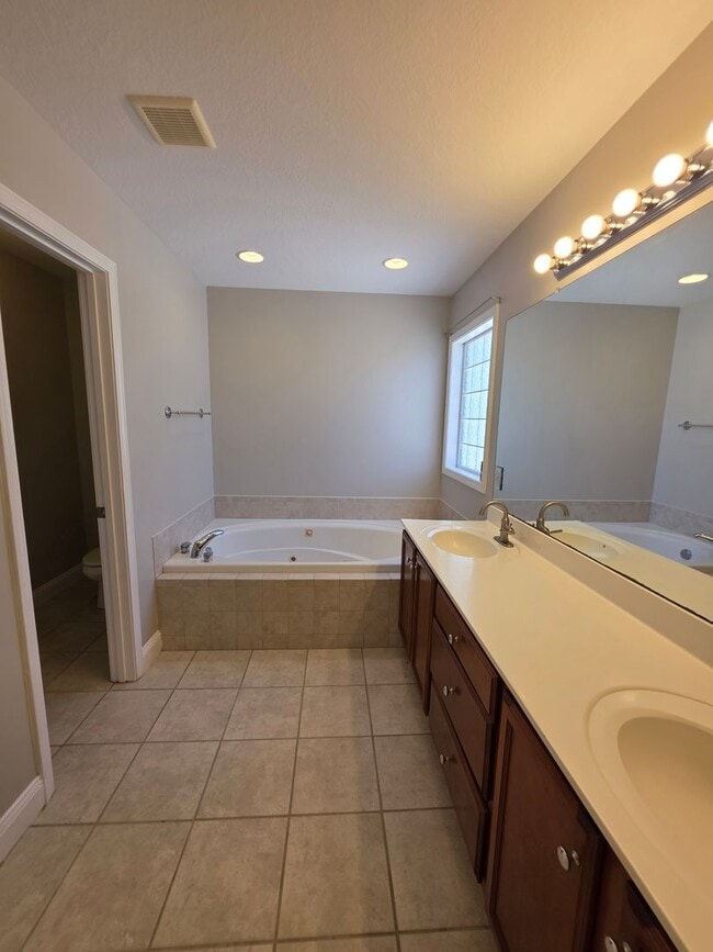 Building Photo - Spacious 4-Bedroom Bryan Farms Beauty with Bonus Suite, Large Fenced Yard & RV/Boat Parking!