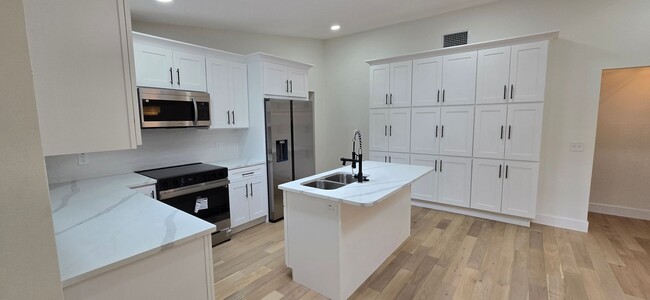 Building Photo - Completely remodeled 4 Bed 4 Bath home wit...