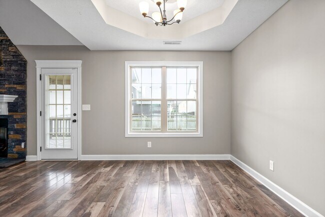 Building Photo - Pet Friendly Three Bedroom with Bonus!