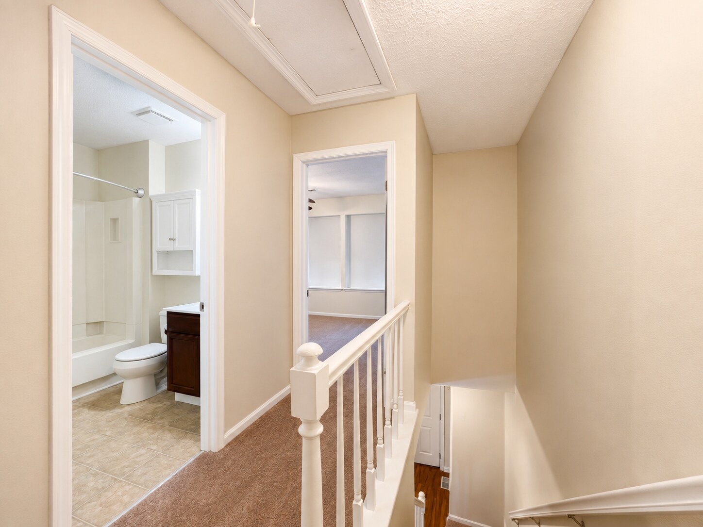 Top of the stairs looking towards master bedroom. - 5484 Pine Top Cir