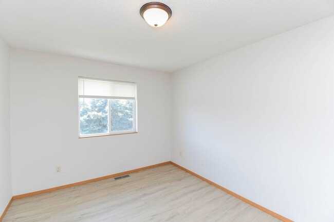 Building Photo - Updated 3BR Split-Level Home with Huge Deck, Fenced Yard & 2-Car Garage Near I-29!