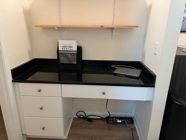 Building Photo - Unfurnished First Floor Condo w/ Garage!