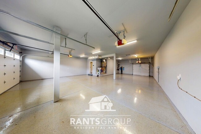 Building Photo - Luxury 4-Bedroom Home with 5-Car Garage & ...
