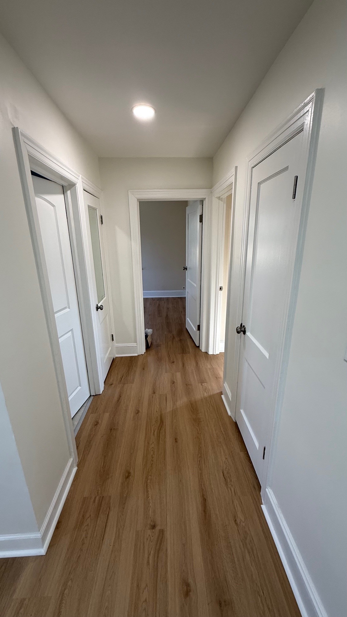 hall to bath and bedrooms downstairs - 122 N Fir Ave