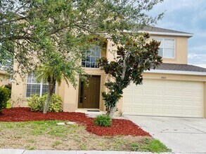Building Photo - **SUNCOAST LAKES GATED COMMUNITY**