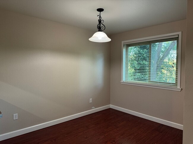 Building Photo - Serene Ground-Floor Condo Overlooking Green Space – Parking Included