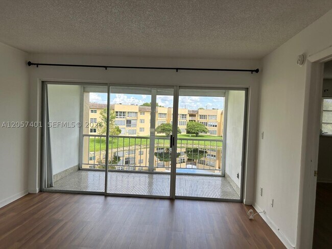 Building Photo - 6090 NW 64th Ave