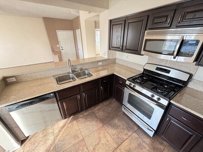 Building Photo - Charming 2Bed/Bath Condo located in a beautiful gated community in the Southwest.