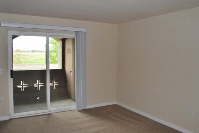Private patios with glass doors for bold natural light! - Bristol Apartment Homes